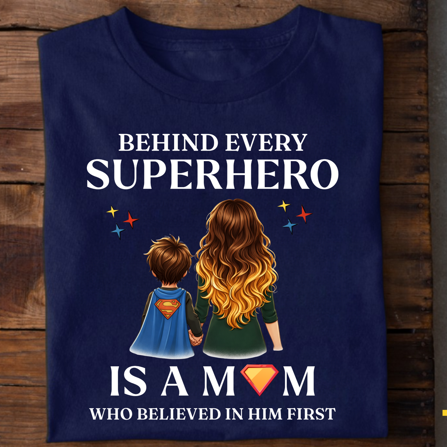 BEHIND EVERY SUPERHERO IS A MOM WHO BELIEVED IN HIM FIRST (MOTHER) CLASSIC T-SHIRT