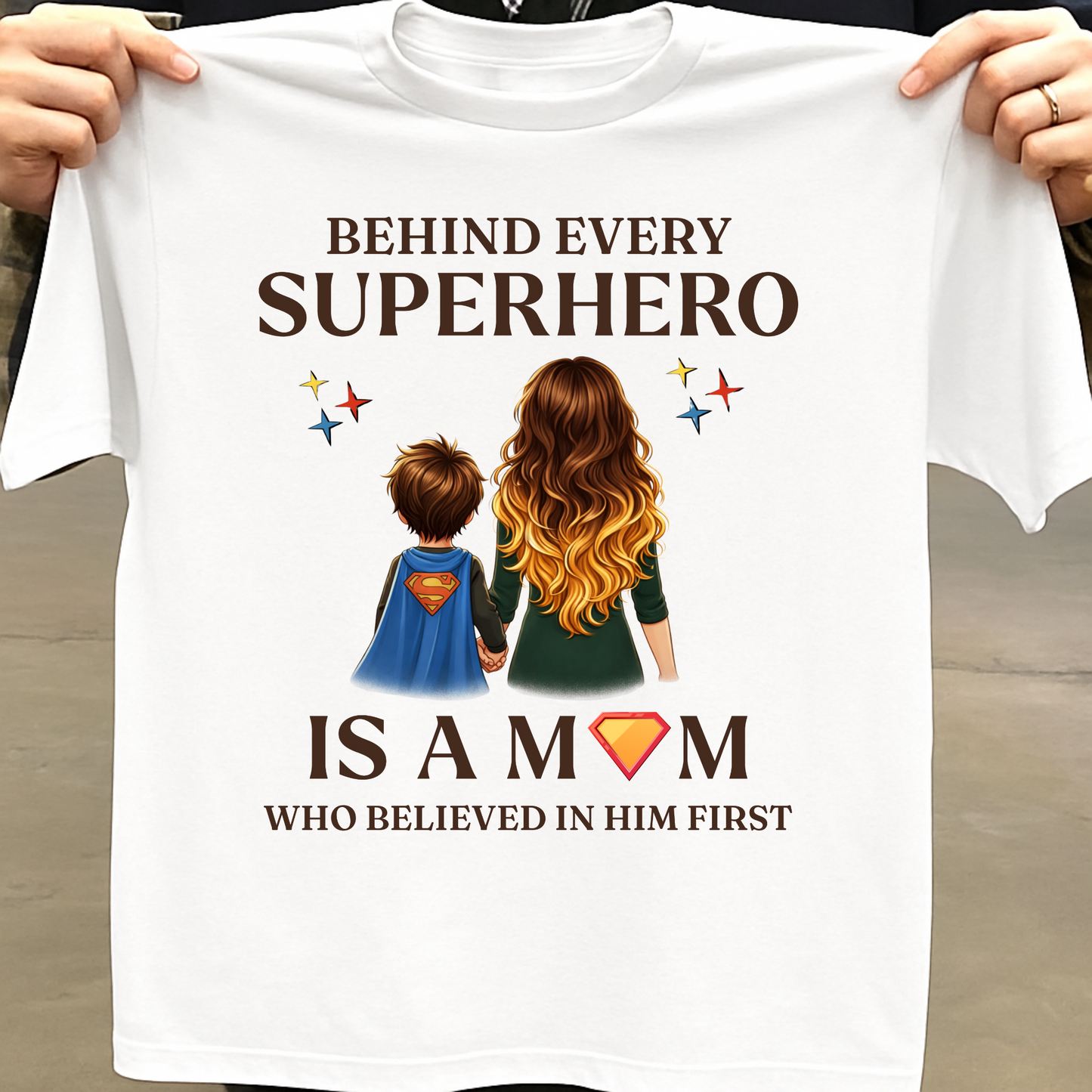 BEHIND EVERY SUPERHERO IS A MOM WHO BELIEVED IN HIM FIRST (MOTHER) CLASSIC T-SHIRT
