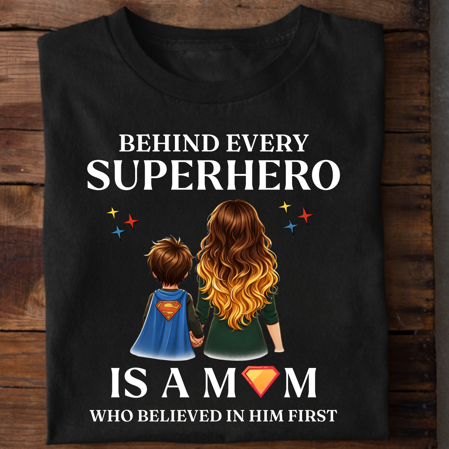 BEHIND EVERY SUPERHERO IS A MOM WHO BELIEVED IN HIM FIRST (MOTHER) CLASSIC T-SHIRT