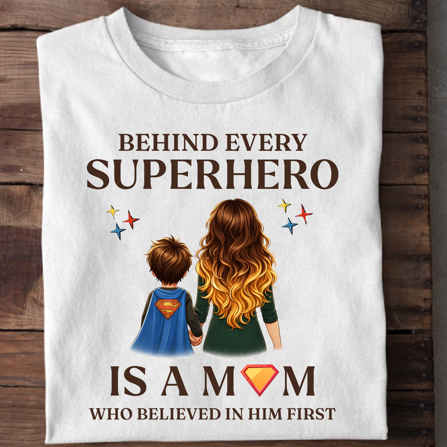BEHIND EVERY SUPERHERO IS A MOM WHO BELIEVED IN HIM FIRST (MOTHER) CLASSIC T-SHIRT